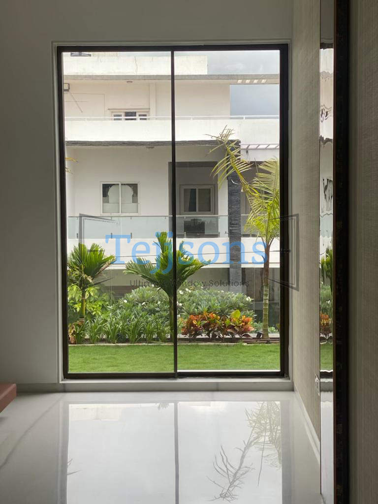 10+ Modern Aluminium Sliding Window Designs Perfect for Luxury Homes & Commercial Spaces 4 Ultra-Slim Two-Panel Aluminium Sliding Windows with Garden View
