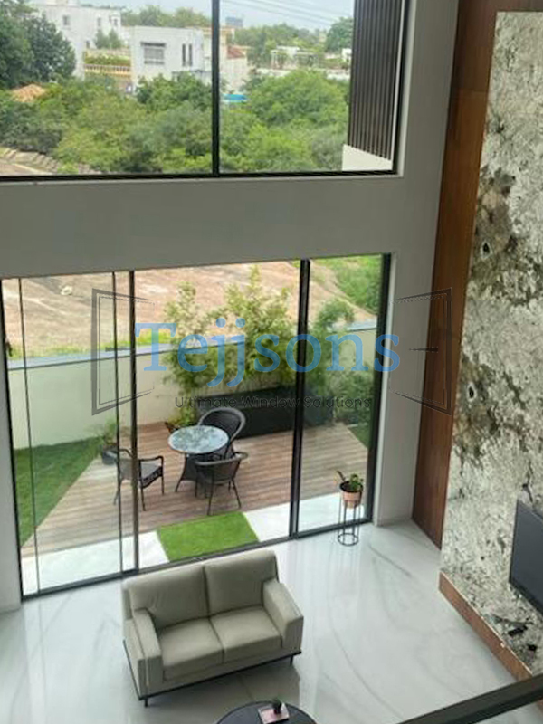10+ Modern Aluminium Sliding Window Designs Perfect for Luxury Homes & Commercial Spaces 9 Double-Height Aluminium Sliding Window Design for Home Interiors