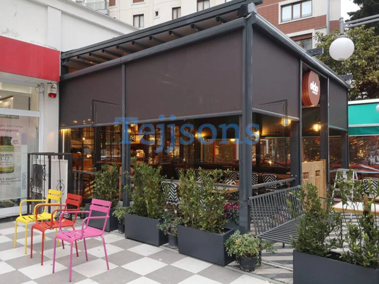 Outdoor café with modern zip blinds for shade and privacy