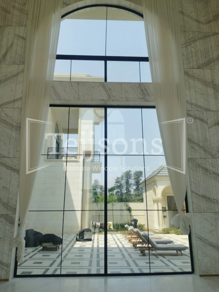 How Aluminium Windows Improve Natural Ventilation in Modern & Luxury Homes 2 Sleek arched aluminium window for elegant modern architecture
