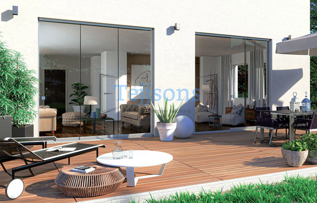 Minimalist patio with full-height sliding doors & outdoor seating