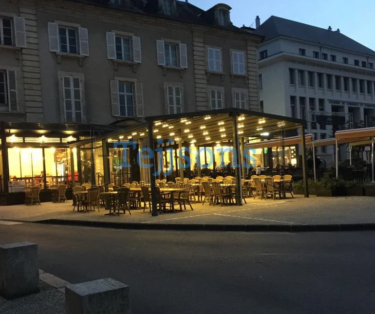 How An Aluminium Pergola Can Transform Your Outdoor Space 1 Aluminium pergola with warm lighting covering restaurant patio