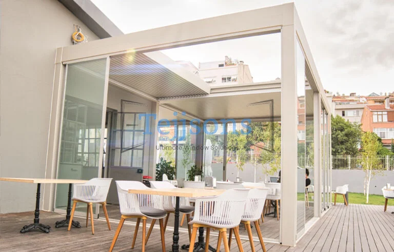 How An Aluminium Pergola Can Transform Your Outdoor Space 5 Bioclimatic motorized pergola covering a bright outdoor dining area