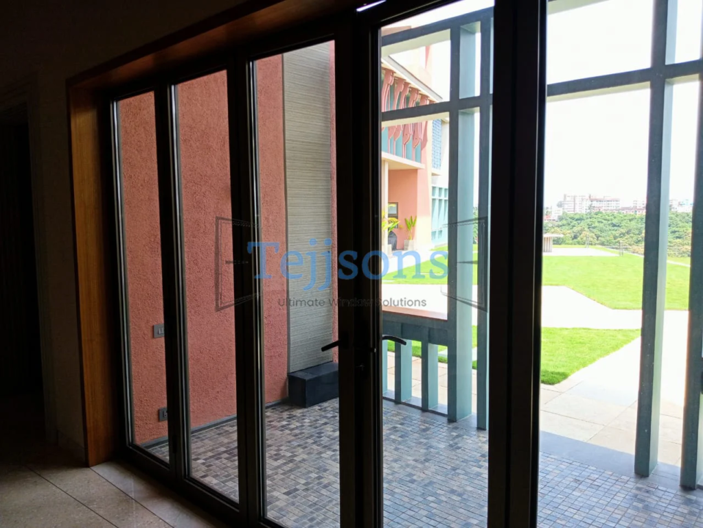 Contemporary home entry styled with black slide and fold doors