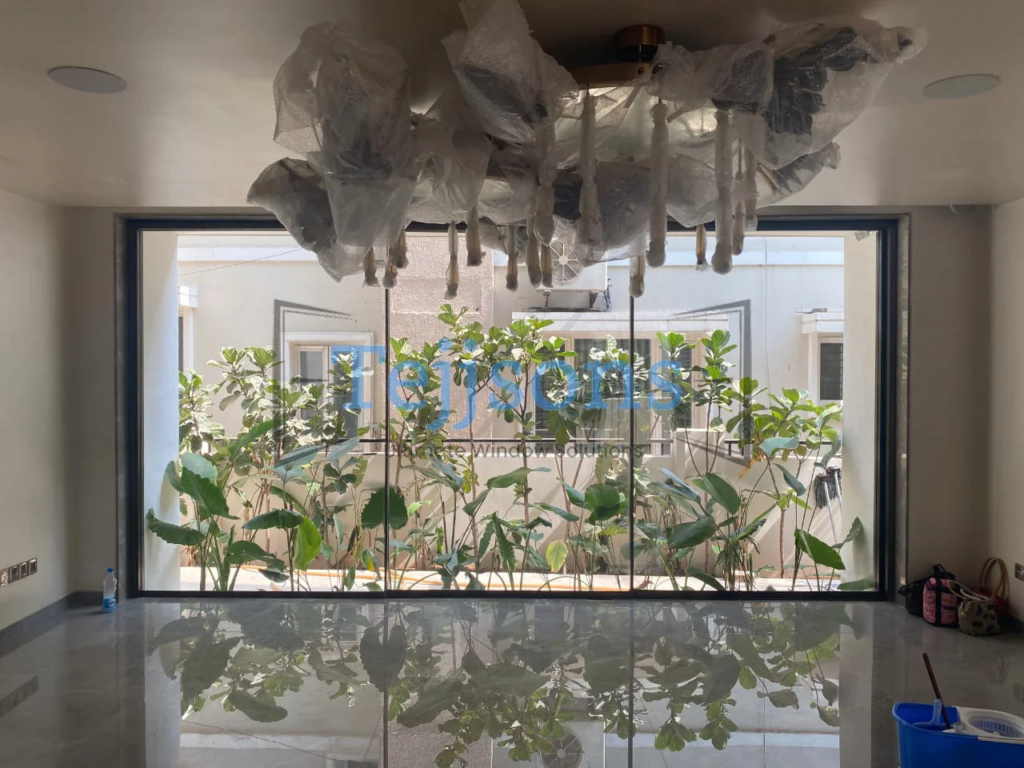 Large aluminium windows showcasing indoor garden view