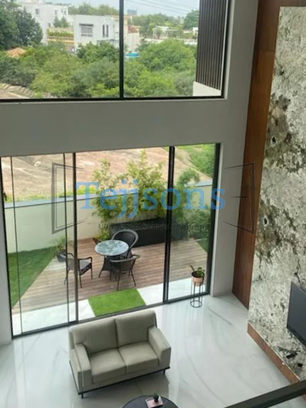 How to Choose the Right Main Door That Stands Up to Rain and Heat 3 Double-height entrance with large glass main door