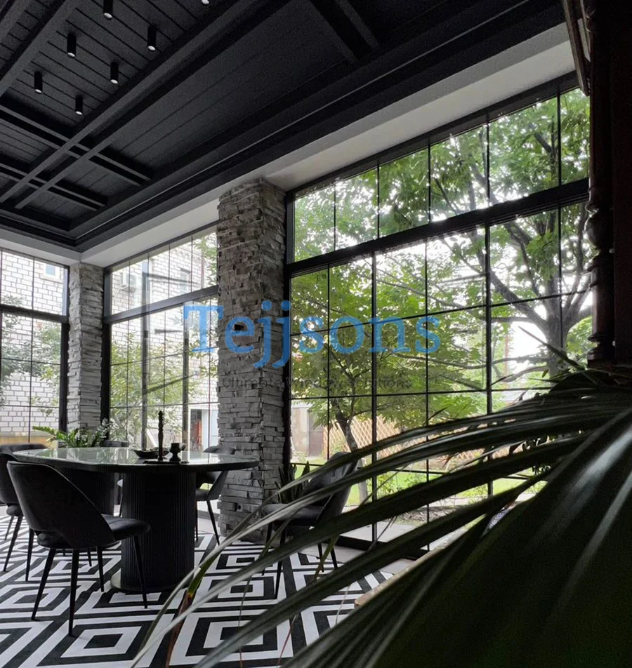 Modern dining area with large fixed glass windows and garden view