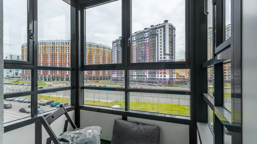 Modern push-out casement window opens with a modern city view